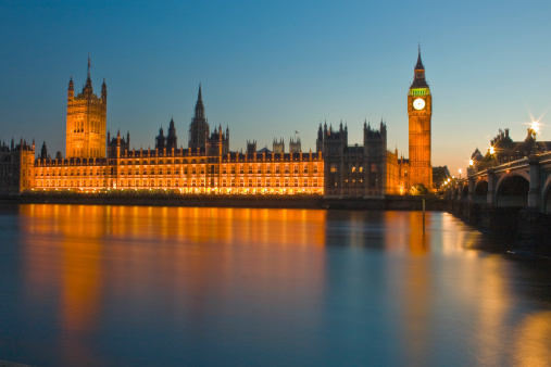View across the River Thames of the Houses of Parliament at night