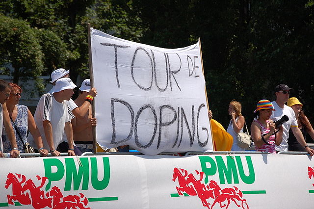 Anti-doping protesters with a protest banner