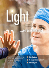 Light magazine front cover showing UK health service worker