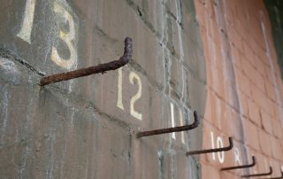 Pegs in a Military Barracks, ending in the number 13